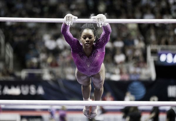 Gabby Douglas on the Uneven Bars. Photo Credit: Ezra Shaw of Getty Images