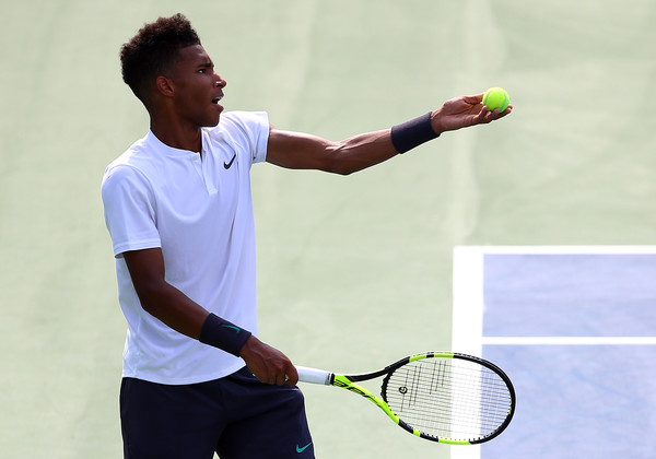 Félix Auger-Aliassime tosses up a serve during his Rogers Cup debut on Tuesday in Toronto. Photo: Getty Images