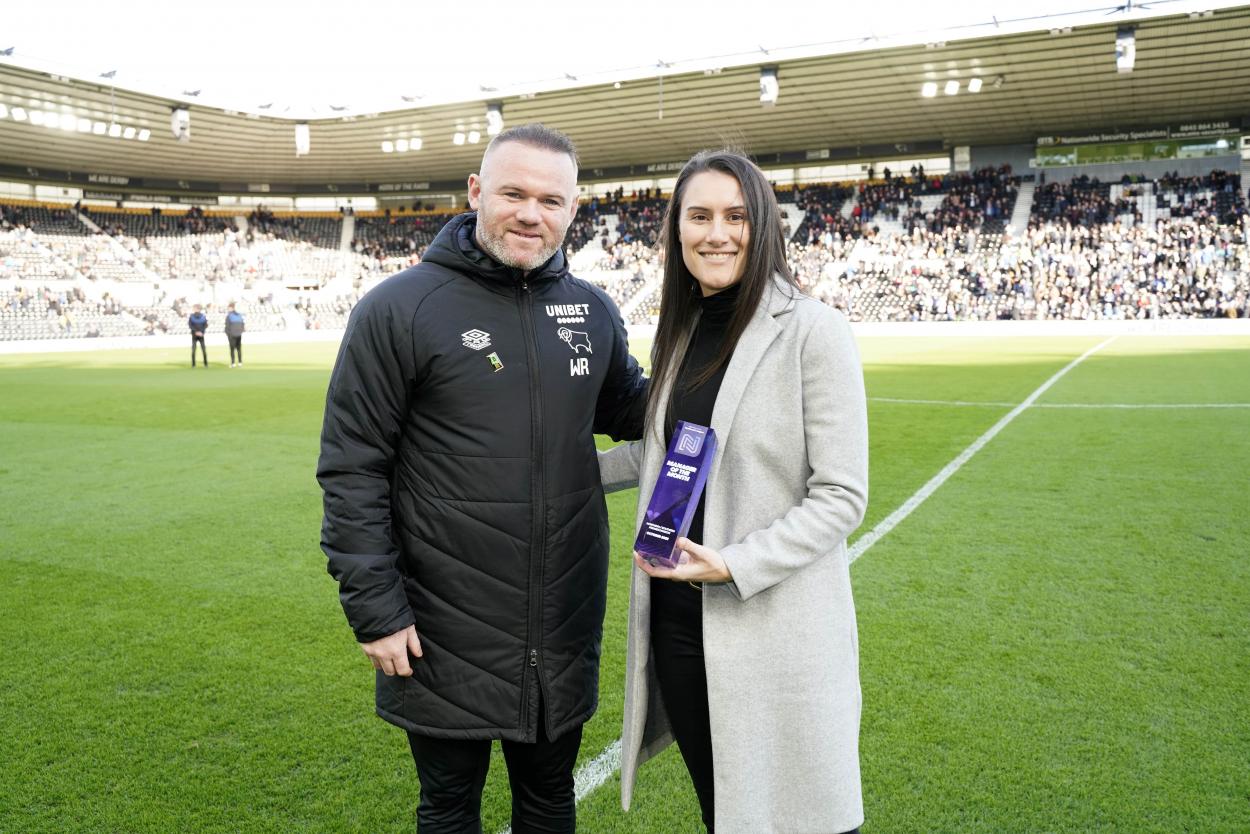 Samantha Griffiths is presented with her manager of the month award by Wayne Rooney | Photo: Derby County Women