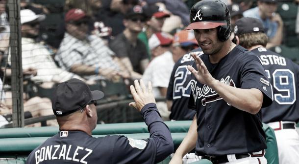 Fred Gonzalez high-fives Jeff Francouer during a spring training game in March. (John Raoux/AP)