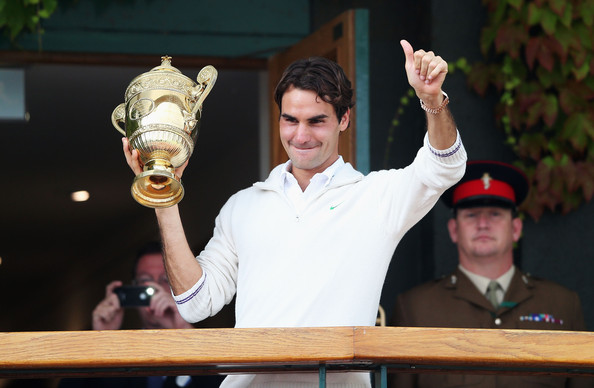 Roger Federer celebrates his Wimbledon crown in 2012, which propelled him back to number one. Photo: Clive Rose/Getty Images