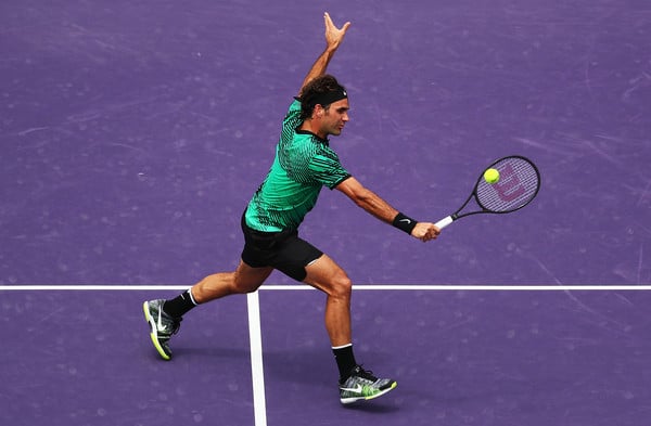 Federer hits a backhand volley during his finals victory. Photo: Al Bello/Getty Images