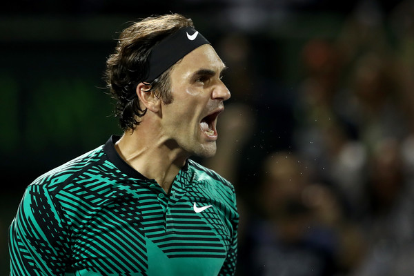 Federer reacts after defeating Nick Kyrgios in the semifinals. Photo: Julian Finney/Getty Images