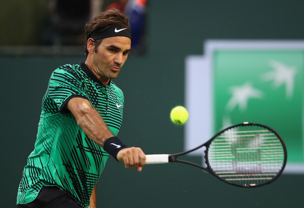 Federer hits a backhand during his quarterfinal win. Photo: Clive Brunskill/Getty Images