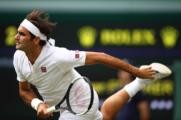 Roger Federer follows through on a serve, which was his dominant shot on Wednesday. Photo: Clive Mason/Getty Images