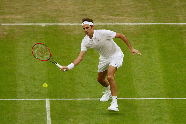Federer hits a forehand volley during his second-round win. Photo: Adam Pretty/Getty Images