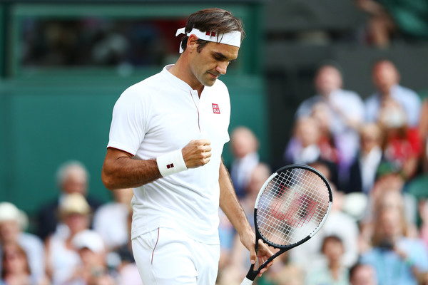 Federer pumps his fist during his win over Struff. Photo: Matthew Stockman/Getty Images