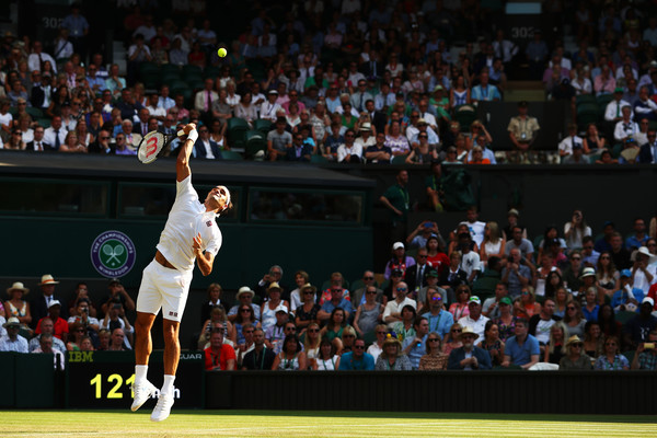 Roger Federer serves on Centre Court during his round three win. Photo: Matthew Stockman/Getty Images