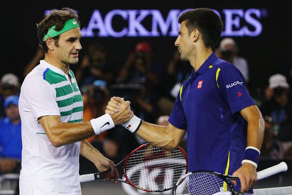 Federer (left) and Djokovic shake hands after their semifinal. Photo: Michael Dodge/Getty Images