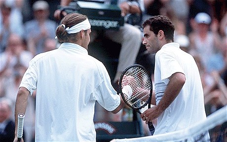 Federer (left) and Sampras shake hands after Federer's five-set win over Sampras at Wimbledon in 2001. Photo: Getty Images