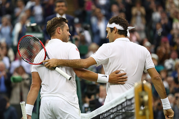 Federer (right) and Willis embrace at the net after the match. Photo: Julian Finney/Getty Images