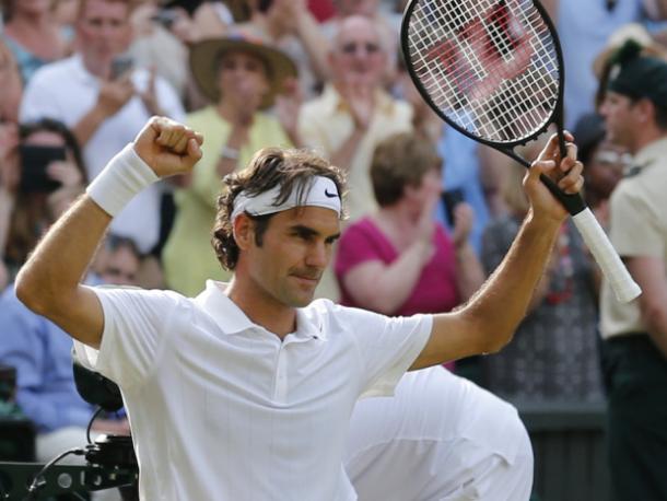Federer celebrates his 2014 semi-final victory over Milos Raonic at Wimbledon to reach his first major final since 2012. Photo: Ben Curtis, AP/National Post