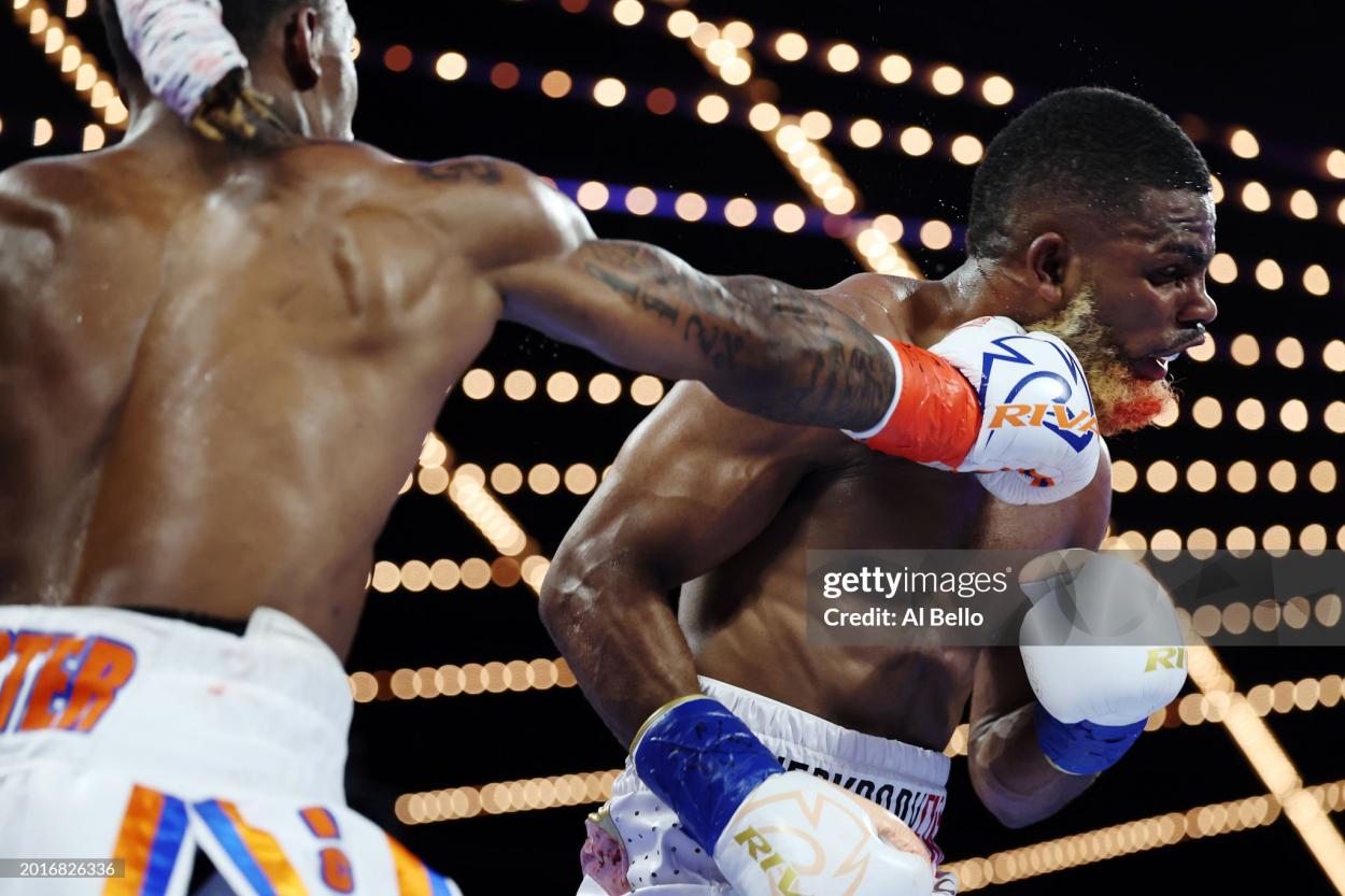 NEW YORK, NEW YORK - FEBRUARY 16: Abraham Nova (white, gold, and red trunks) trades punches with O’Shaquie Foster (white, orange, and blue trunks) during their WBC Junior Lightweight World title fight at The Theatre at Madison Square Garden on February 16, 2024 in New York City. (Photo by Al Bello/Getty Images)