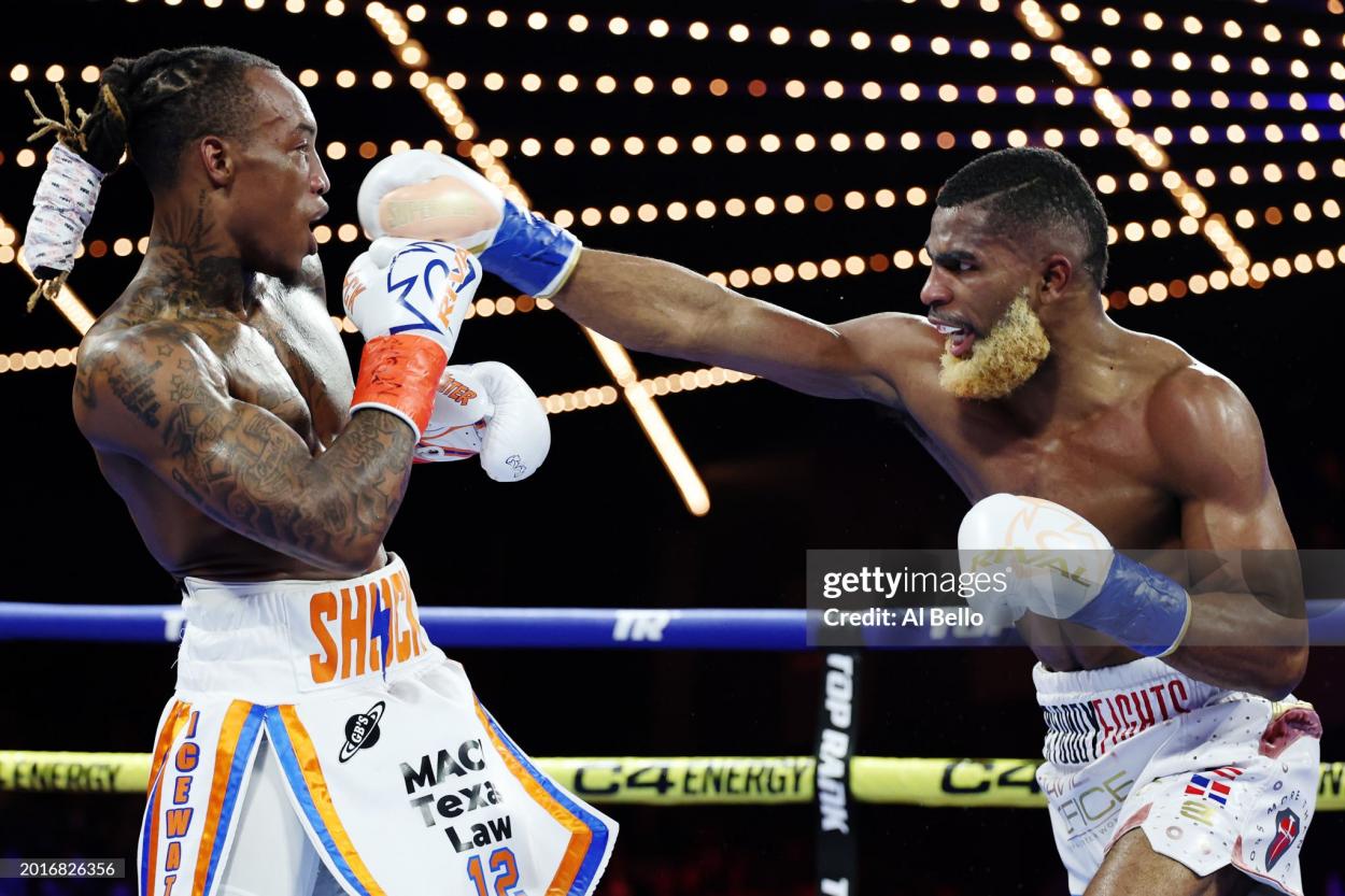 NEW YORK, NEW YORK - FEBRUARY 16: Abraham Nova (white, gold, and red trunks) trades punches with O’Shaquie Foster (white, orange, and blue trunks) during their WBC Junior Lightweight World title fight at The Theatre at Madison Square Garden on February 16, 2024 in New York City. (Photo by Al Bello/Getty Images)