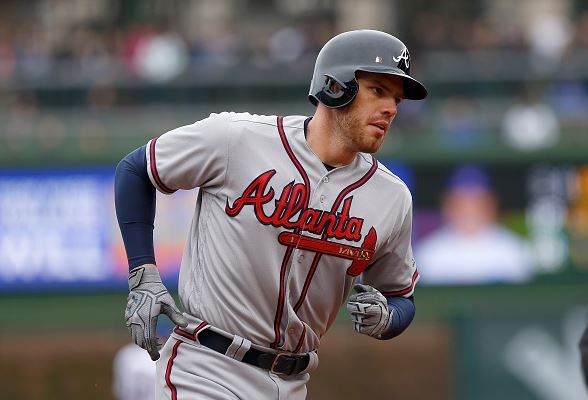 Freddie Freeman of the Atlanta Braves rounds the bases after hitting a home run in the fourth inning against the Chicago Cubs at Wrigley Field on April 29, 2016 | Dylan Buell - Getty Images