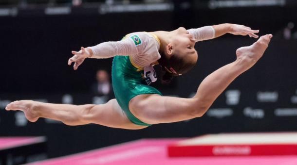 Flavia Saraiva perfroms on the balance beam at the 2015 World Artistic Gymnastics Championships in Glasgow/Getty Images