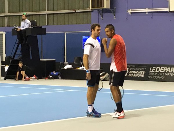 Gabashvili (left) and Kyrgios discuss strategy during their match (Photo: Open 13)