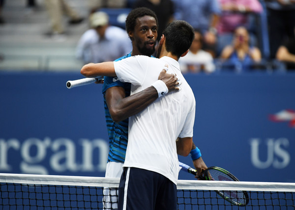 Monfils and Djokovic after their US Open match (Photo by Mike Hewitt/Getty Images)