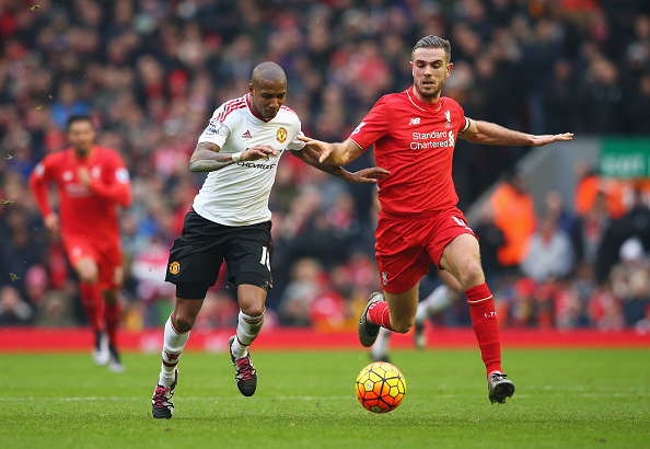 Jordan Henderson battles Ashley Young for possession of the ball. (Getty)