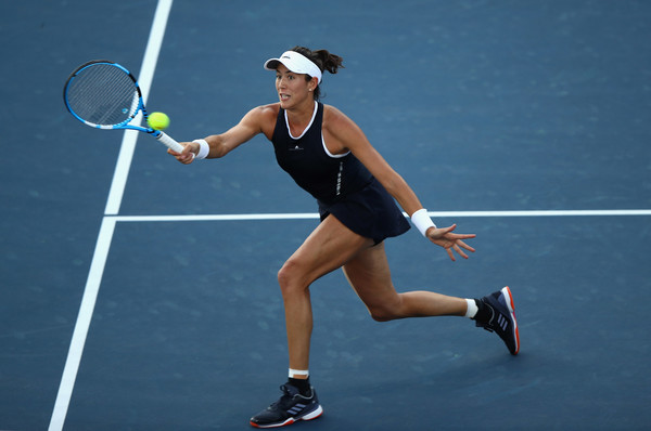 Garbiñe Muguruza lunges to hit a volley during her second-round match at the 2017 Bank of the West Classic. | Photo: Ezra Shaw/Getty Images