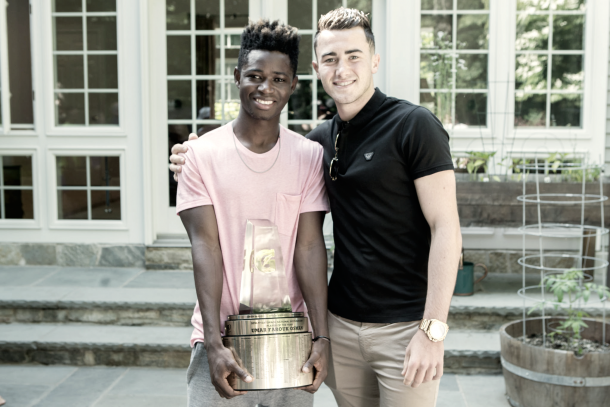 Jack Harrison takes a picture with Umar as he holds his new award. | Photo: Gatorade