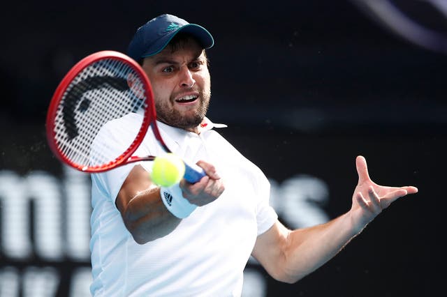 Karatsev hits a forehand during his quarterfinal victory/Photo: Daniel Pockett/Getty Images