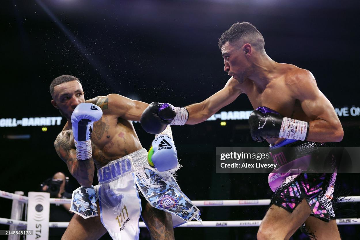 MANCHESTER, ENGLAND - APRIL 13: Zelfa Barrett dodges the punch of Jordan Gill during the WBA International Super-Featherweight title fight between Jordan Gill and Zelfa Barrett at AO Arena on April 13, 2024 in Manchester, England. (Photo by Alex Livesey/Getty Images)