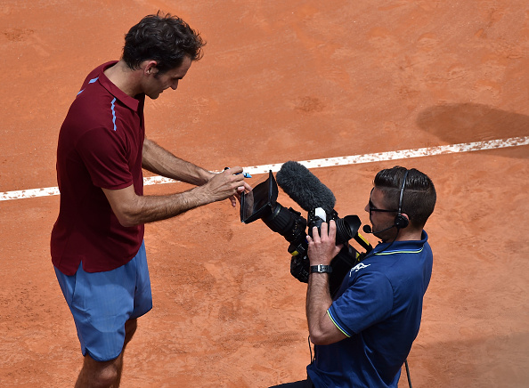 A relieved Federer signs the camera following his victory. Credit: Giuseppe Bellini/Getty Images