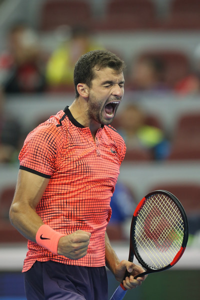 Grigor Dimitrov celebrates after winning a point during his second-round match against Lucas Pouille at the 2016 China Open. | Photo: Emmanuel Wong/Getty Images
