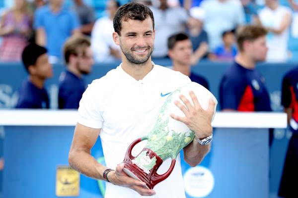 Dimitrov poses with the famous vase at the Western and Southern Open (Matthew Stockman/Getty Images North America)