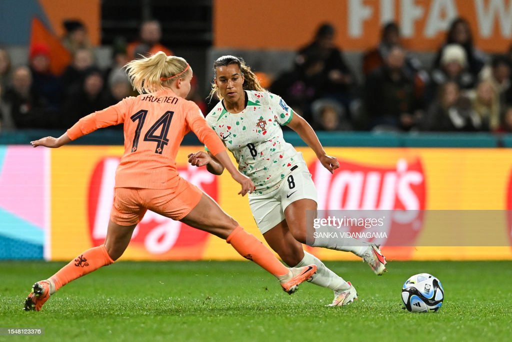 Portugal's midfielder #08 Andreia Norton (R) and Netherlands' midfielder #14 Jackie Groenen vie for the ball during the Australia and New Zealand 2023 Women's World Cup Group E football match between the Netherlands and Portugal at Dunedin Stadium in Dunedin on July 23, 2023. (Photo by Sanka Vidanagama / AFP) (Photo by SANKA VIDANAGAMA/AFP via Getty Images)