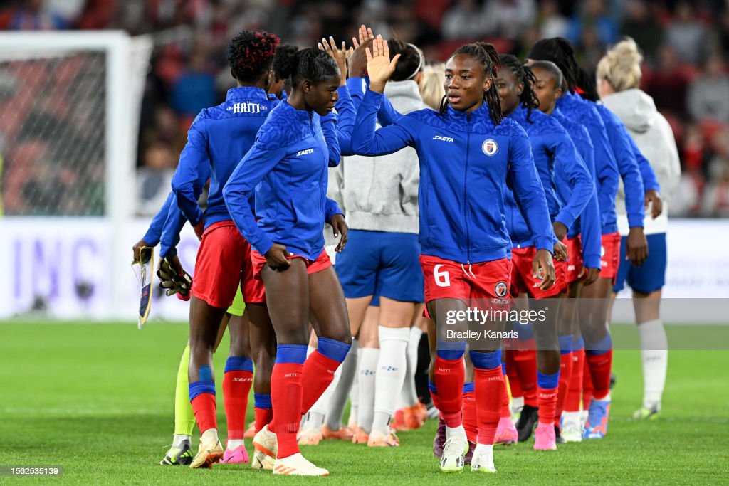 Haiti players high five prior to the FIFA Women's <strong><a  data-cke-saved-href='https://www.vavel.com/en/football/2023/06/09/1148811-inzaghis-and-inters-chance-to-write-history.html' href='https://www.vavel.com/en/football/2023/06/09/1148811-inzaghis-and-inters-chance-to-write-history.html'>World Cup</a></strong> Australia & New Zealand 2023 Group D match between England and Haiti at Brisbane Stadium on July 22, 2023 in Brisbane, Australia. (Photo by Bradley Kanaris/Getty Images)