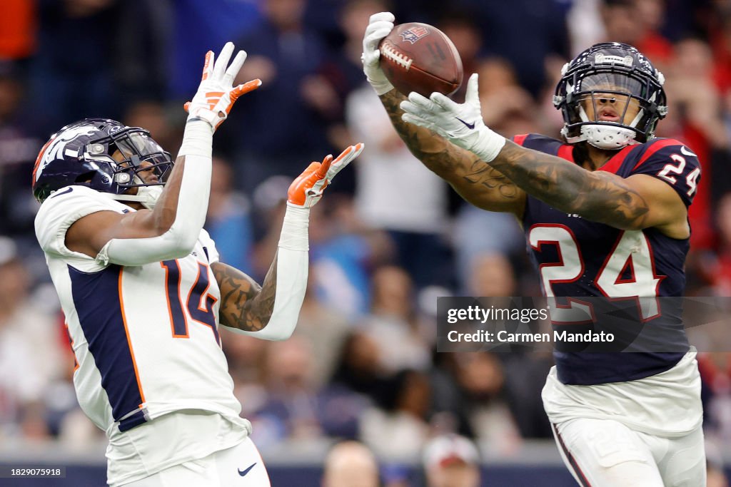 Derek Stingley Jr. #24 of the Houston Texans makes an interception past Courtland Sutton #14 of the Denver Broncos in the fourth quarter at NRG Stadium on December 03, 2023 in Houston, Texas. (Photo by Carmen Mandato/Getty Images)