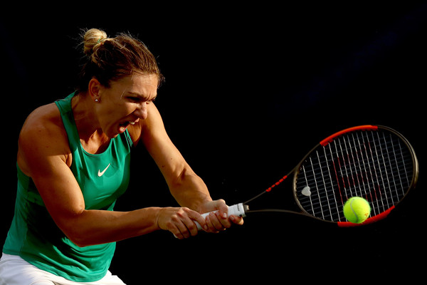 Halep crushes a backhand during her quarterfinal win. Photo; Matthew Stockman/Getty Images