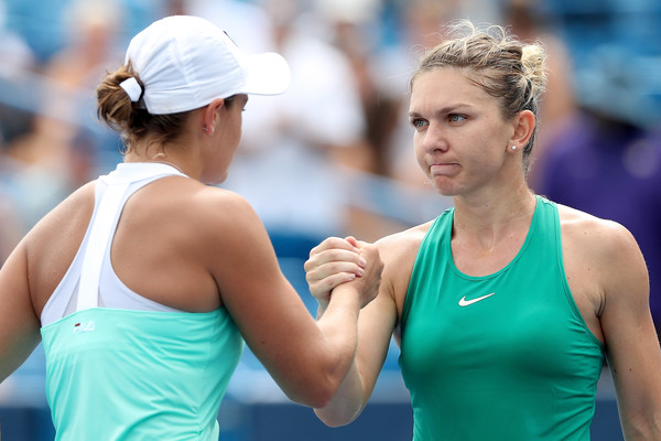 Halep and Ashleigh Barty (left) shake hands after their third-round meeting. Photo: Matthew Stockman/Getty Images