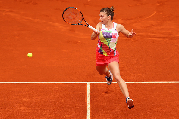 Simona Halep leaps into a forehand during her quarterfinal. Photo: Julian Finney/Getty Images