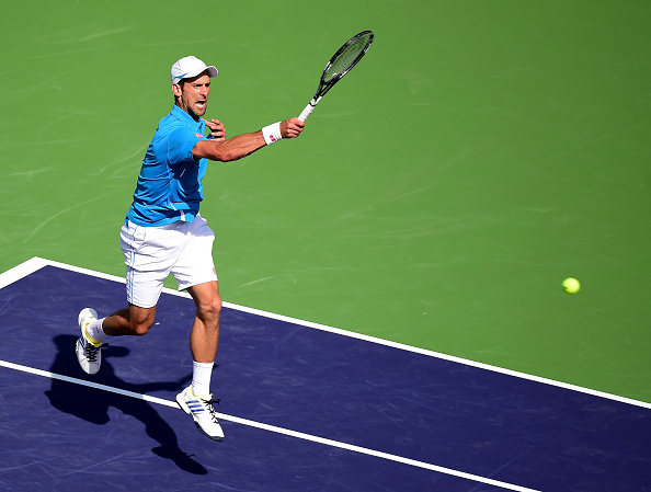 Djokovic rips a forehand winner down the line. Credit: Harry How/Getty Images