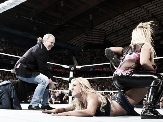 Hart and Natalya both lock in the submission move side by side (image: independent.co.uk)