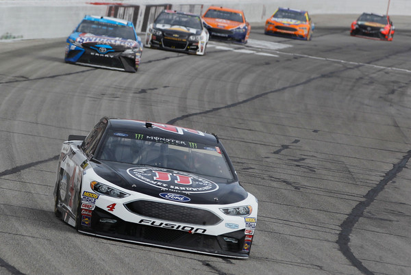 Harvick leads a pack of cars. (Brian Lawdermilk/Getty Images North America0