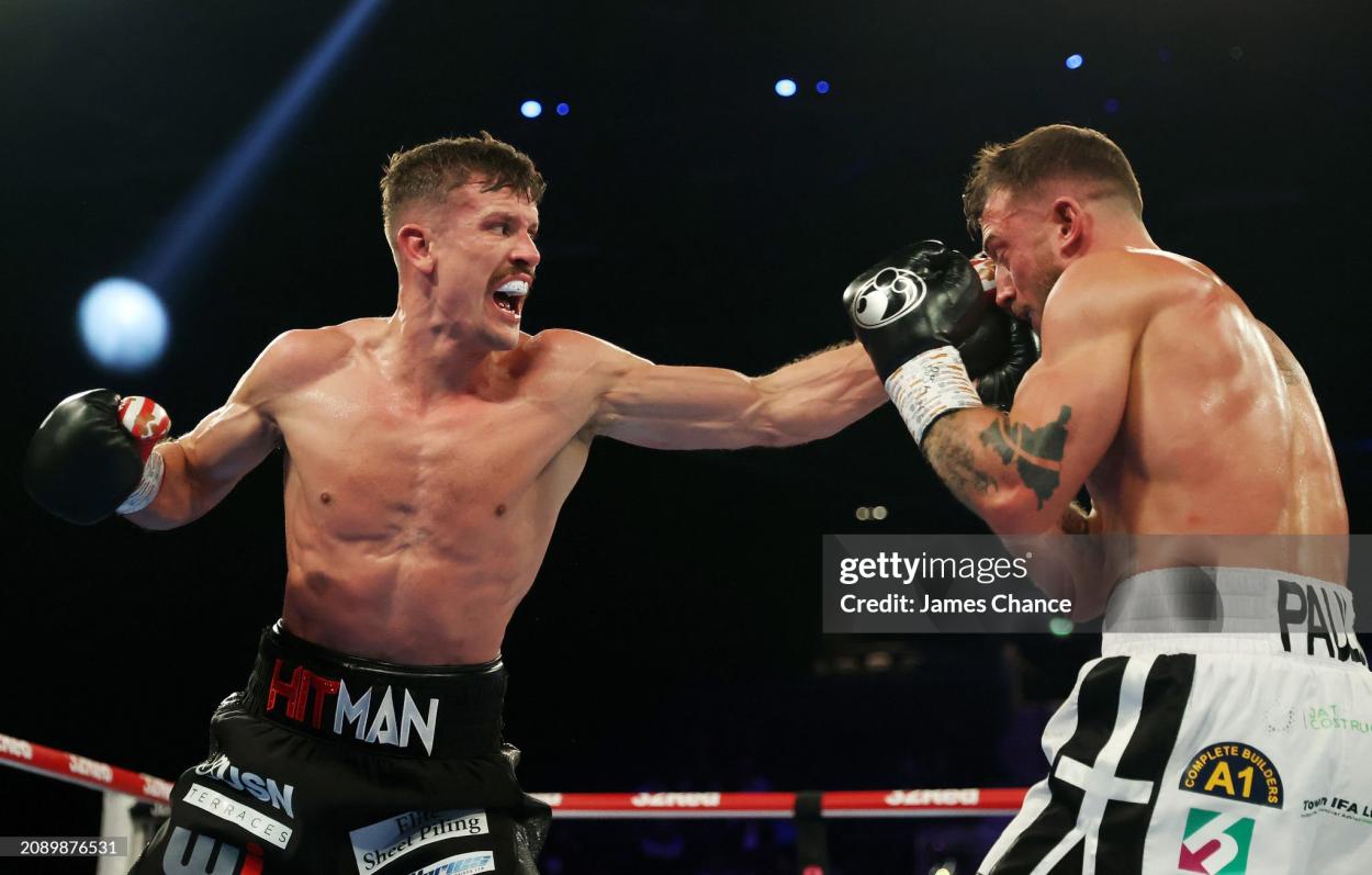 BIRMINGHAM, ENGLAND - MARCH 16: Nathan Heaney punches Brad Pauls during the British Middleweight Title fight between Nathan Heaney and Brad Pauls at Resorts World Arena on March 16, 2024 in Birmingham, England. (Photo by James Chance/Getty Images)