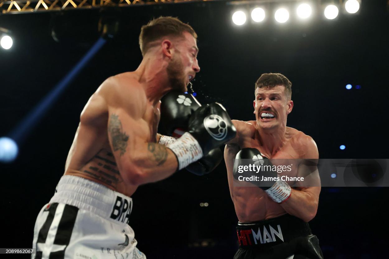 BIRMINGHAM, ENGLAND - MARCH 16: Nathan Heaney punches Brad Pauls during the British Middleweight Title fight between Nathan Heaney and Brad Pauls at Resorts World Arena on March 16, 2024 in Birmingham, England. (Photo by James Chance/Getty Images)