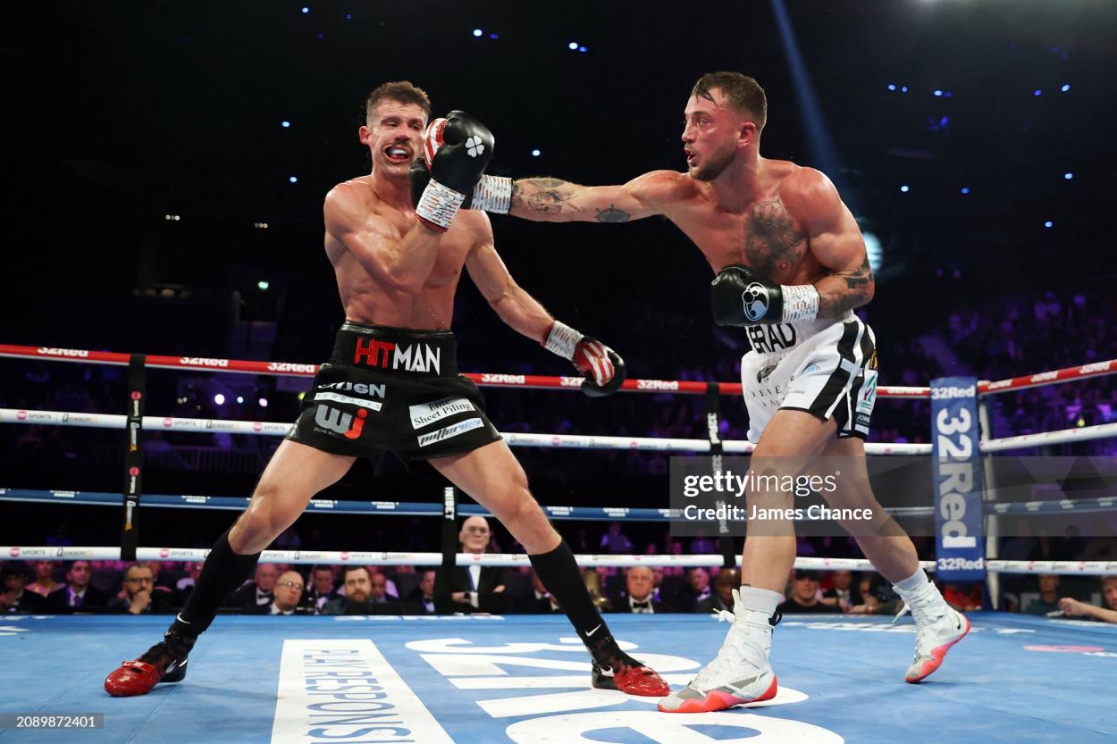 BIRMINGHAM, ENGLAND - MARCH 16: Brad Pauls punches Nathan Heaney during the British Middleweight Title fight between Nathan Heaney and Brad Pauls at Resorts World Arena on March 16, 2024 in Birmingham, England. (Photo by James Chance/Getty Images)