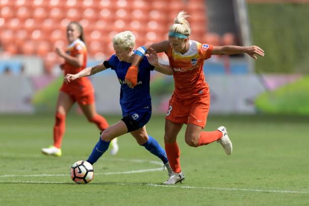 Seattle Reign forward Megan Rapinoe and Houston Dash forward Rachel Daly battle for possession in Houston on May 27, 2017 | Photo: Wilf Thorne, ISI Photos 