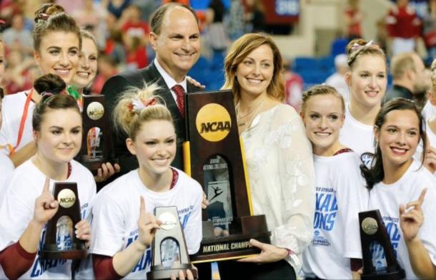 Oklahoma head coach KJ Kindler with her team after winning the NCAA Women's Gymnastics Championships/OU Sports