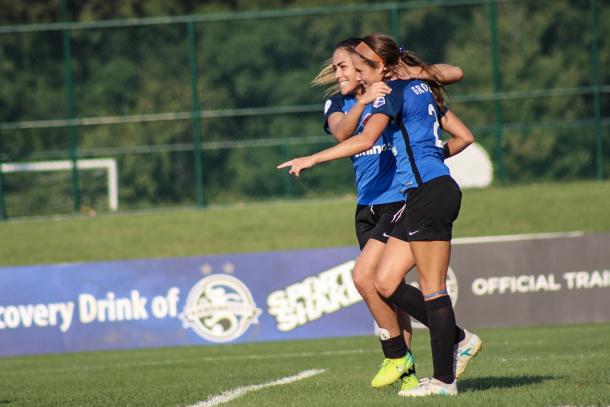 Lo'eau LaBonta and Shea Groom celebrate a goal against Sky Blue FC on September 3 | Source: Cindy Lara - VAVEL USA