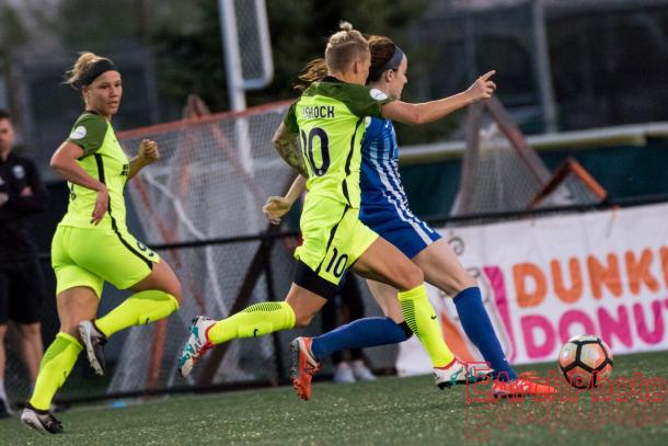 Mathias (far left) as she follows along with the ball in a match against the Boston Breakers | Source: Earchphoto