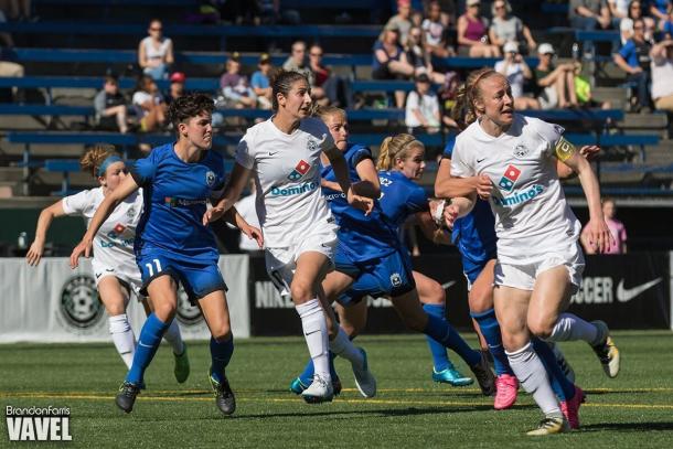 Defender Becky Sauerbrunn (far right) as she holds down the back line to prevent Seattle Reign from scoring | Source: Brandon Farris - VAVEL USA