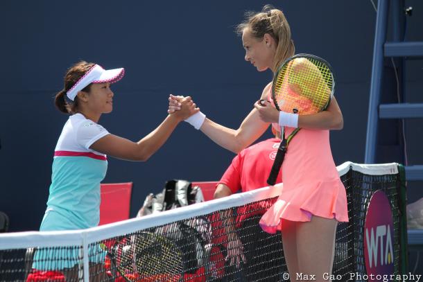 Kurumi Nara (L) and Magdalena Rybarikova shake hands after their thrilling first-round qualifying match at the 2017 Rogers Cup presented by National Bank. | Photo: Max Gao