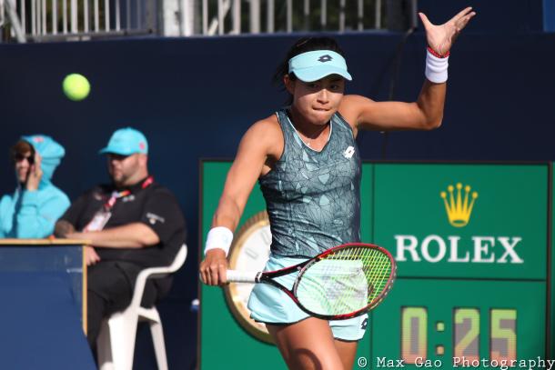 Carol Zhao hits a backhand return during her first-round win in qualifying at the 2017 Rogers Cup presented by National Bank. | Photo: Max Gao