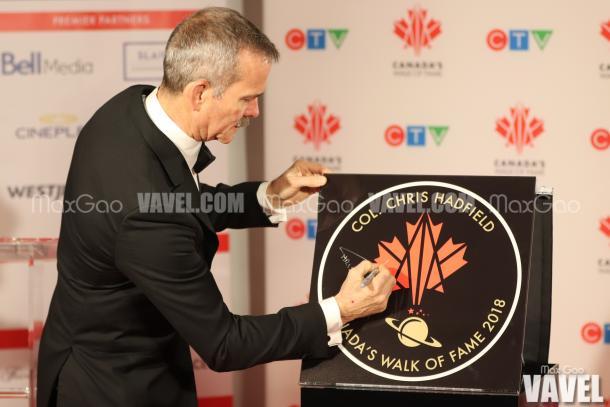 Chris Hadfield signs his star on Canada’s Walk of Fame, which is just another award on a long list of extraordinary awards and accolades for the retired astronaut.